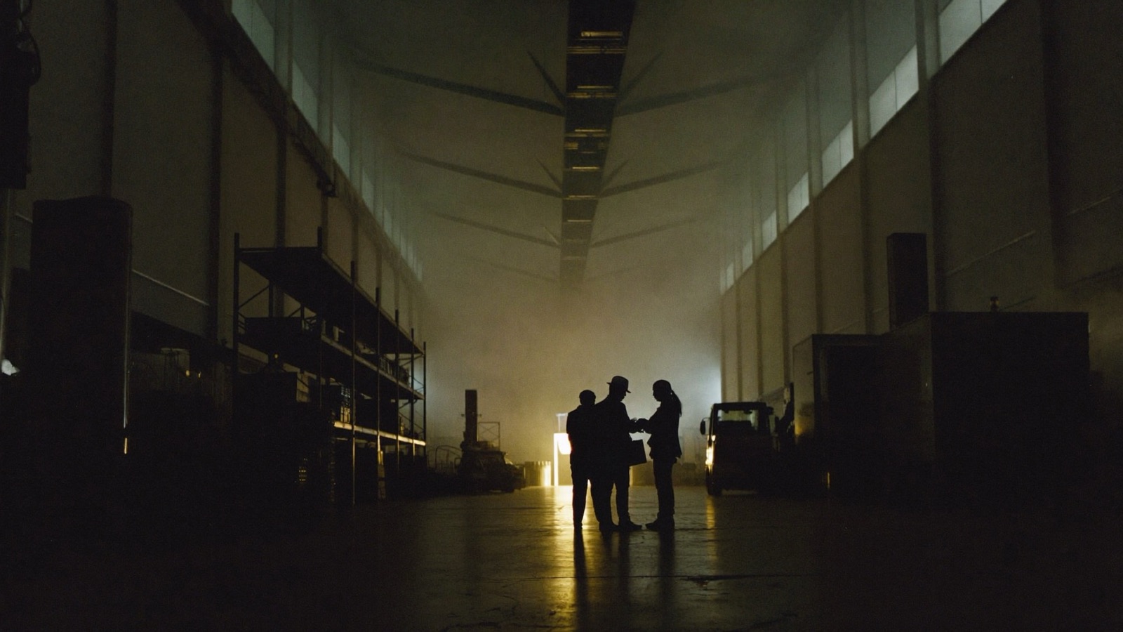 A broker meeting a business owner on a warehouse floor
