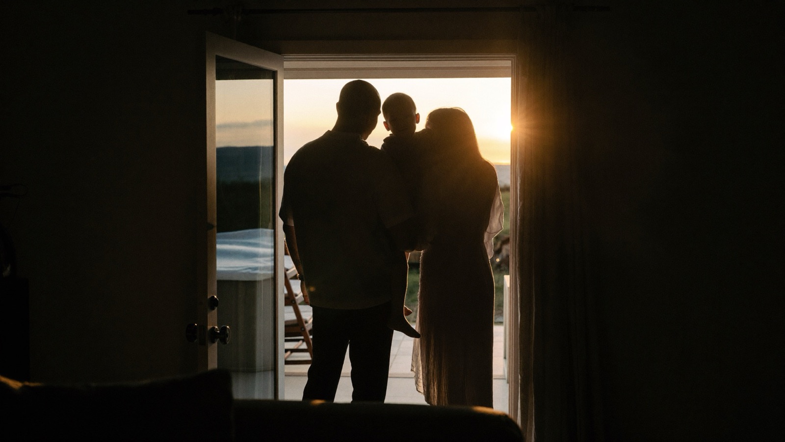 A family in a sunlit doorway